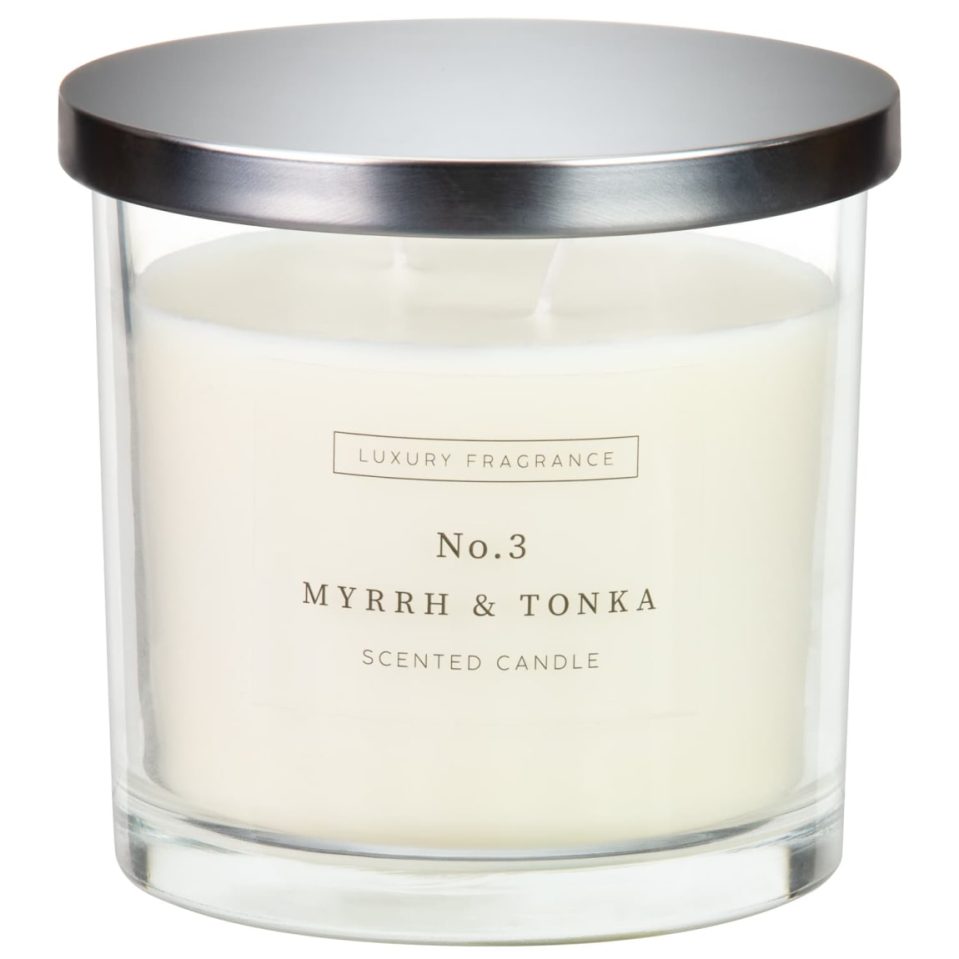 No. 3 Myrrh & Tonka scented candle in a glass jar with a silver lid.