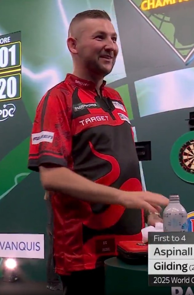 Nathan Aspinall stopped in his tracks during the world darts championship