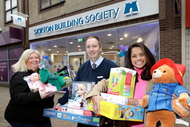 Decluttering expert Dilly Carter donates toys to the Skipton Building Society appeal.