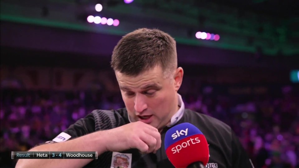 Luke Woodhouse choked up on live TV after knocking close pal Damon Heta out of the World Darts Championships