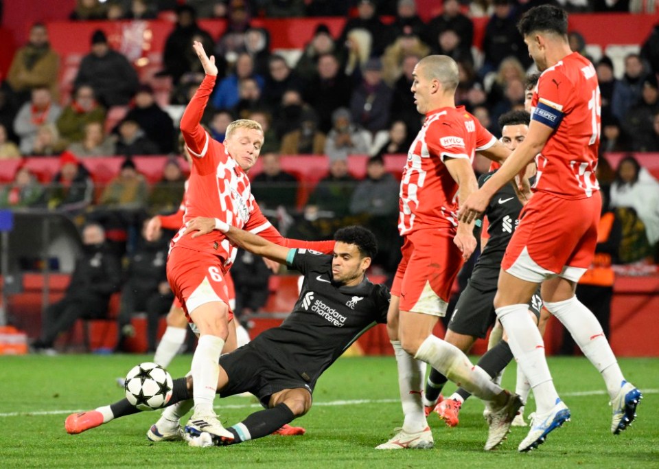 Girona's Dutch midfielder #06 Donny Van de Beek steps on Liverpool's Colombian midfielder #07 Luis Diaz's foot during the UEFA Champions League, league phase football match between Girona FC and Liverpool FC at the Montilivi stadium in Girona on December 10, 2024. (Photo by Josep LAGO / AFP) (Photo by JOSEP LAGO/AFP via Getty Images)