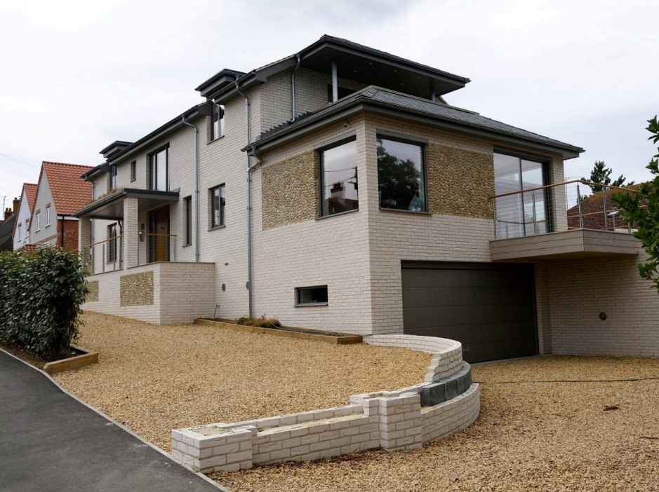 The new home in Wodehouse Road, Old Hunstanton, Norfolk, which sparked fury in the village. Release date  November 27, 2024. The future of a huge new home on a Millionaire's row of houses that inspired author PG Wodehouse and sparked a row within a quiet village is set to be decided. Rising tensions over a controversial new home had lead to parish councillors in Old Hunstanton, Norfolk to issue a public warning to villagers. The parish council had received a string of abusive phone calls over The White Cottage which had allegedly been built in breach of planning permission. Mr and Mrs Middleton, owners of the home, are now seeking retrospective planning permission for the new three storey building on Wodehouse Road. The street is named after PG Wodehouse, the author of the Jeeves and Wooster stories, who was a frequent visitor to the village. The property is at the centre of a furious row, with locals and the parish council claiming the "unsightly" building has breached planning conditions. Villagers claimed the property should have been built as a three-storey home, rather than two. The couple from Lincolnshire denied there had been a breach of planning conditions and the house was always approved as a three-storey home. However they admitted there had been 'slight' alterations to the windows and balcony, and an additional basement room.