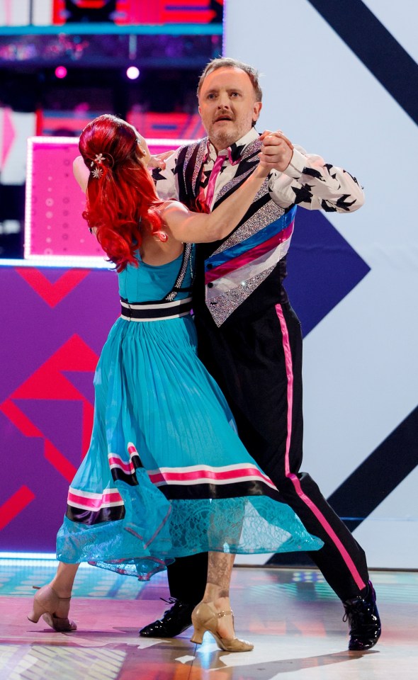 Chris, the show's first blind contestant, and pro partner Dianne Buswell dancing in the final