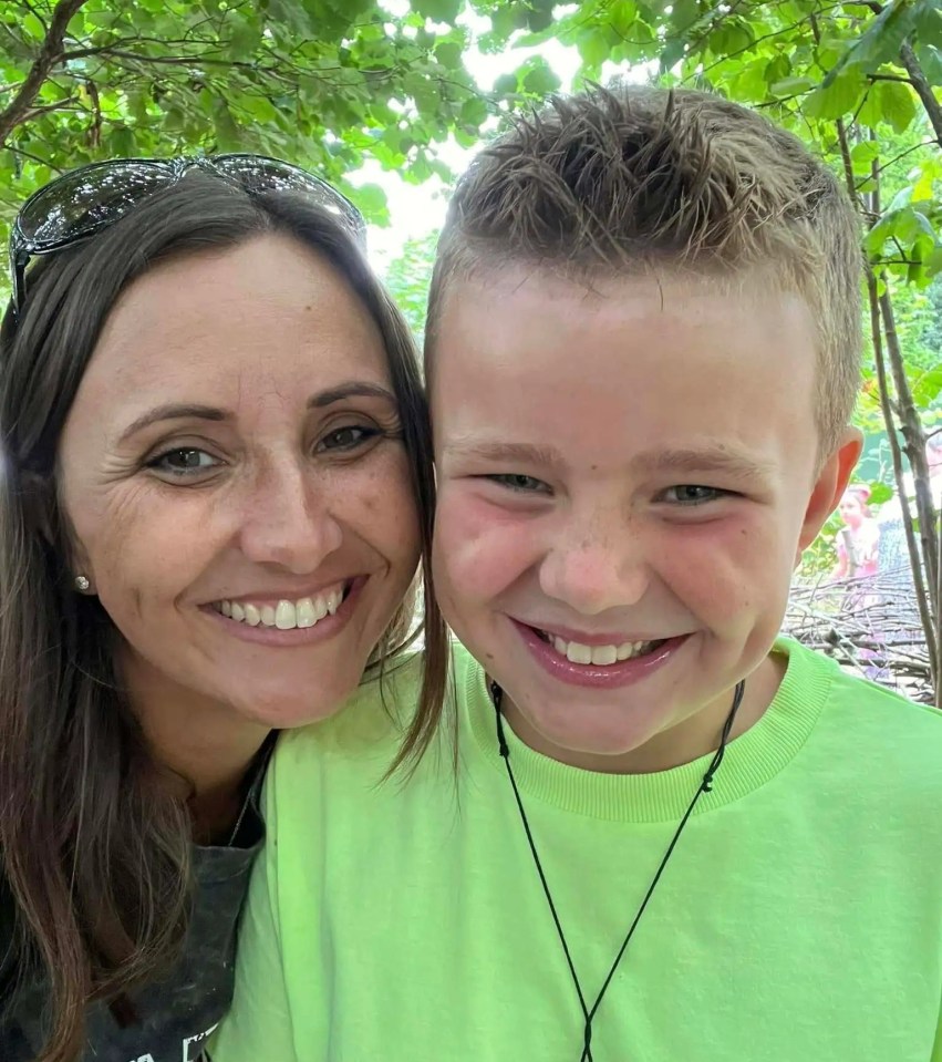 Close-up of a smiling mother and son.