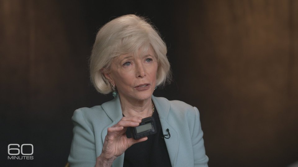 Interviewer Lesley Stahl holding what appears to be one of the devices used in the attacks