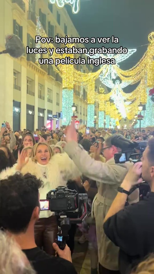 Alan threw his hands in the air as they partied with the locals