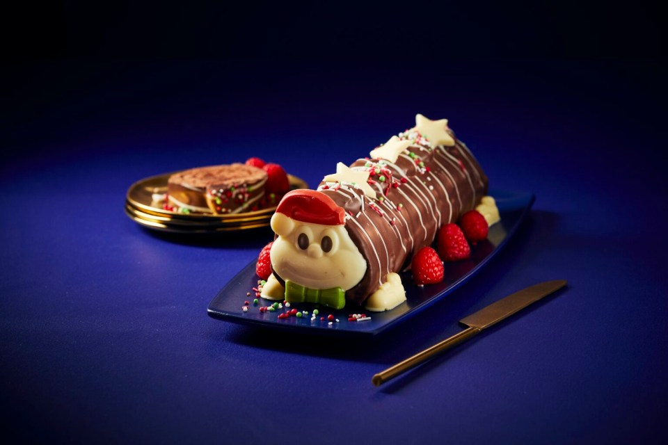 Chocolate Yule log decorated as a Christmas character.