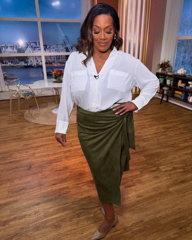 Alison Hammond wearing a white shirt and olive green skirt.