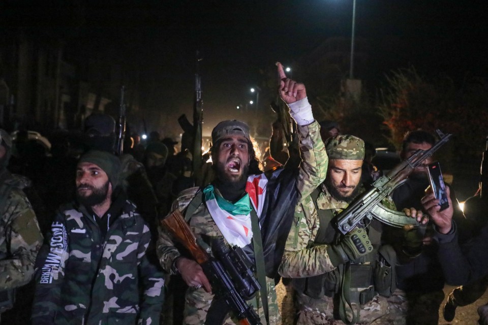 Islamist-led Syrian rebel fighters in Homs after entering Syria's third city in November