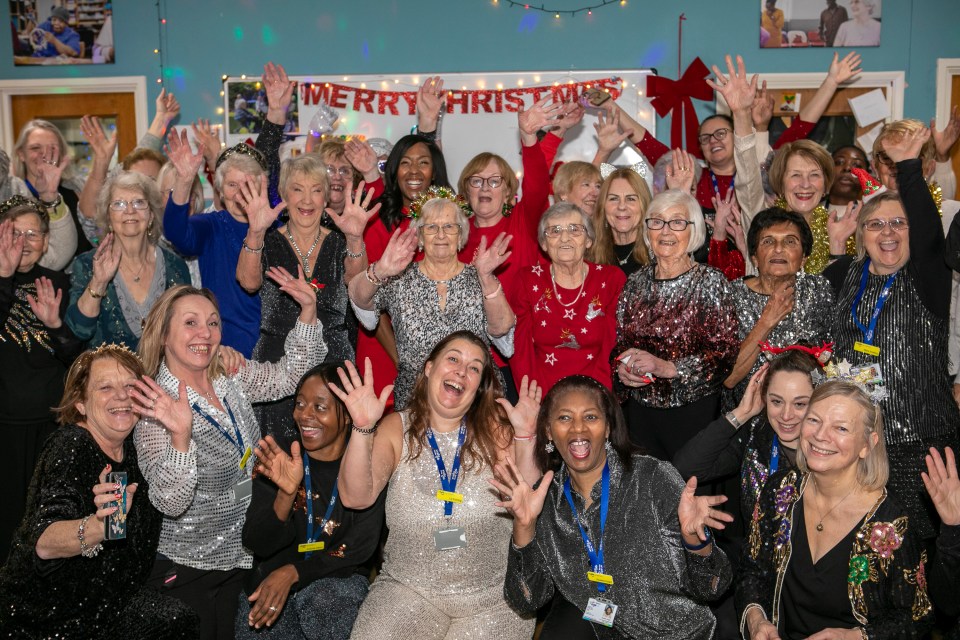 Staff and visitors enjoying the festive bash at Age UK's Merton centre in Mitcham, South London