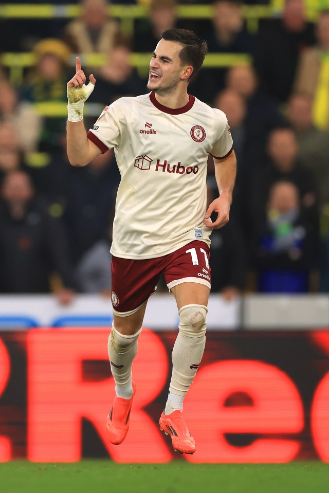 Anis Mehmeti of Bristol City celebrates scoring a goal.