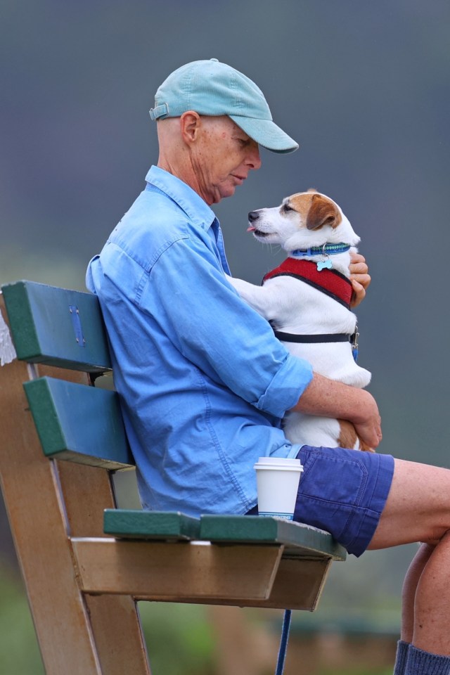 He was also seen sipping from a takeaway coffee cup while sitting on a bench