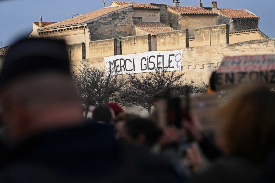 A banner which reads 'Thank you Gisèle' hangs on the city wall in Avignon as the hearing goes ahead today