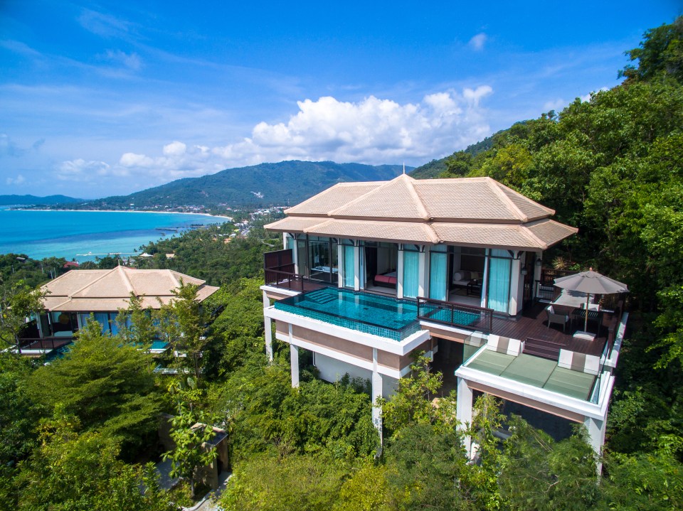 Aerial view of a luxury villa with private pool overlooking the ocean.