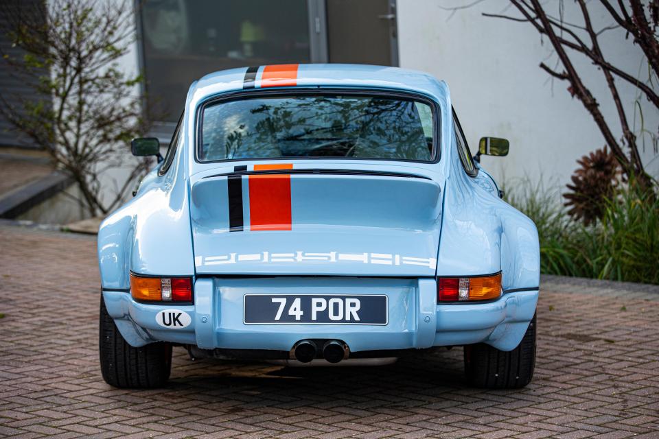 The rear of the Porsche has a duck-tail spoiler