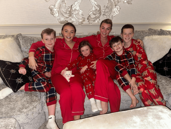 Family in matching red pajamas.