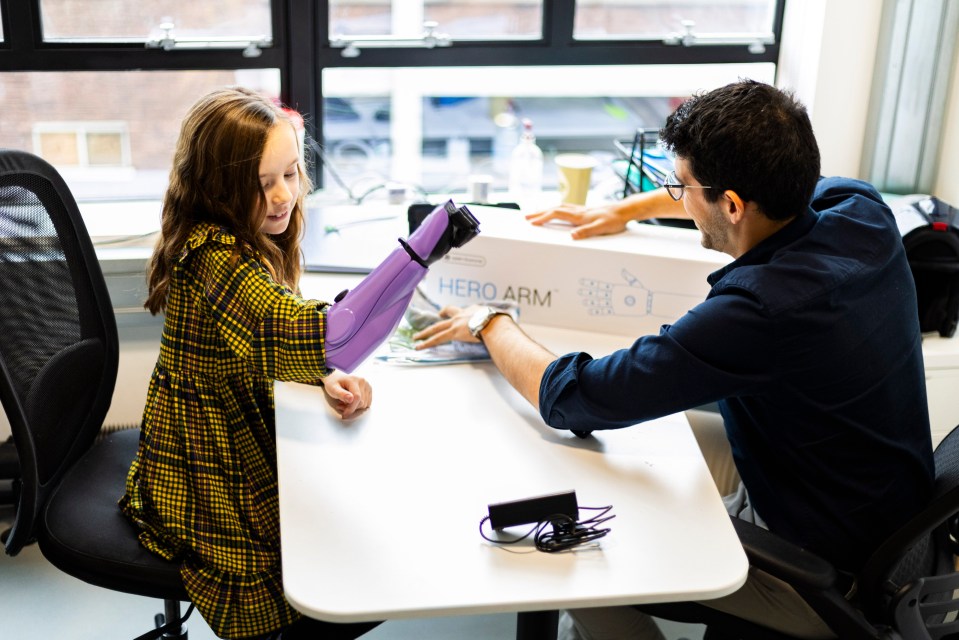 Girl receiving a bionic arm.