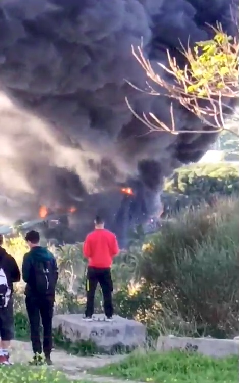 People stood to watch the blaze