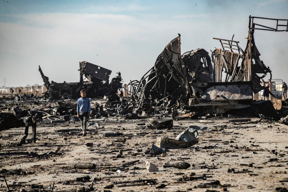 Destroyed military vehicles near Qamishli airbase, north-eastern Syria