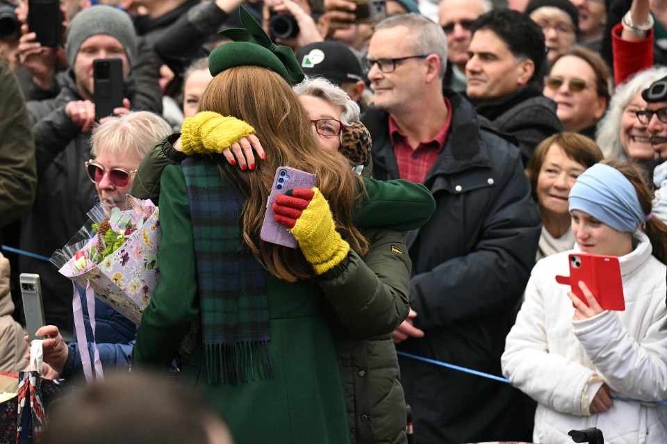 Princess Catherine hugging a well-wisher after a Christmas service.