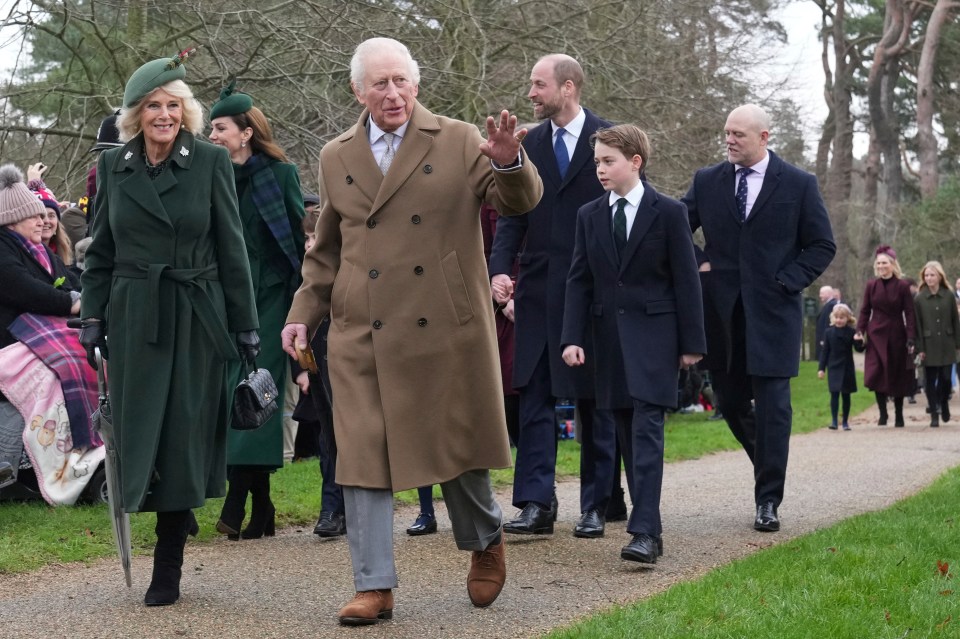 King Charles III waves to the large crowd