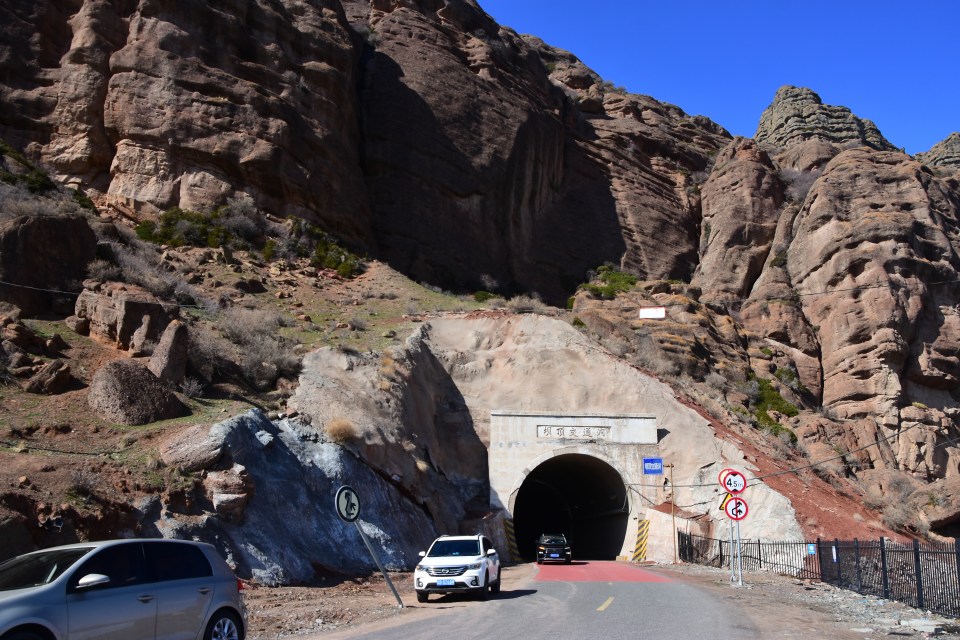 Cars run across a tunnel towards Shimen Reservoir in China