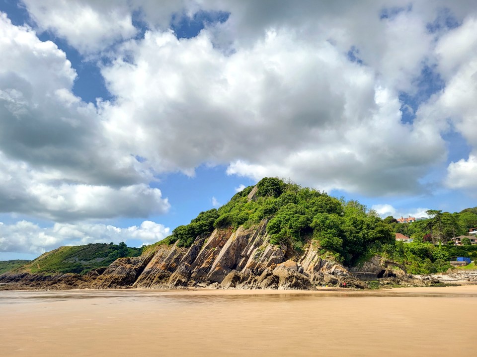 Caswell Bay, a gently sloping beach located on the south Gower Coast, that regularly achieves Blue Flag status