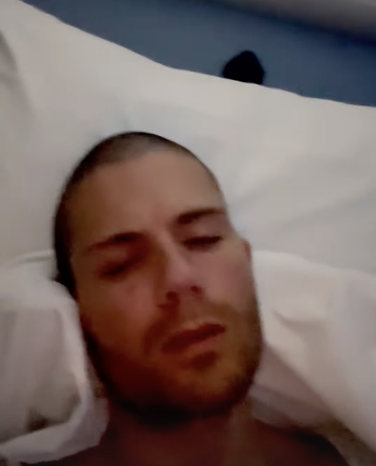 Max George in hospital bed, asking fans for support.