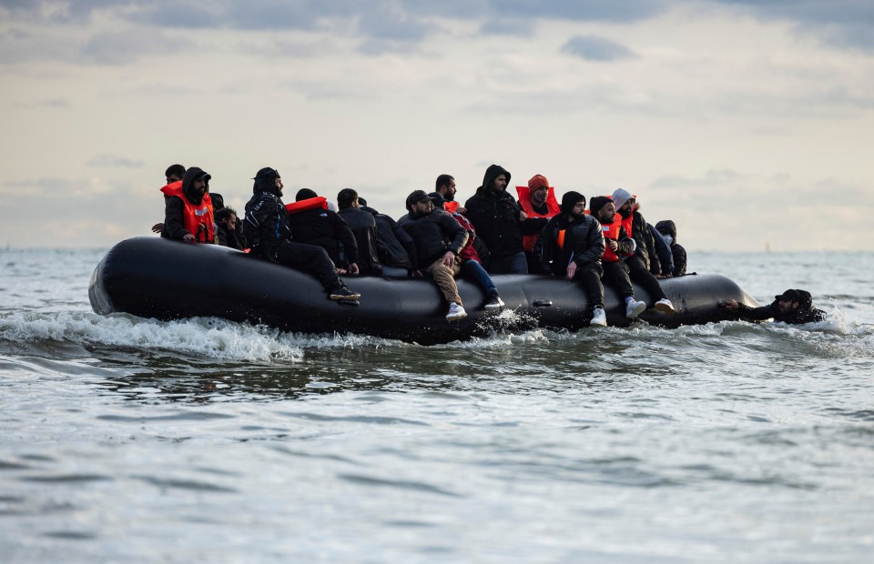 a group of people are in a raft in the ocean