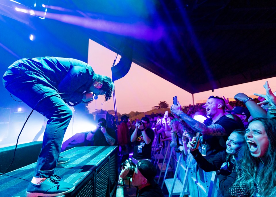 Chino Moreno of Deftones performing on stage.