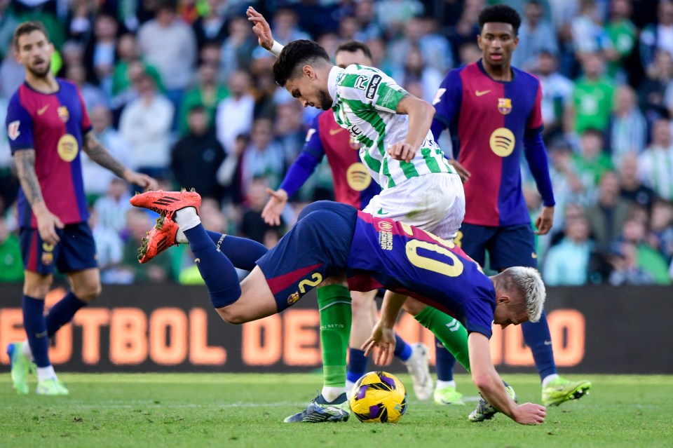 Dani Olmo was fouled by Marc Bartra during Barcelona's match against Real Betis