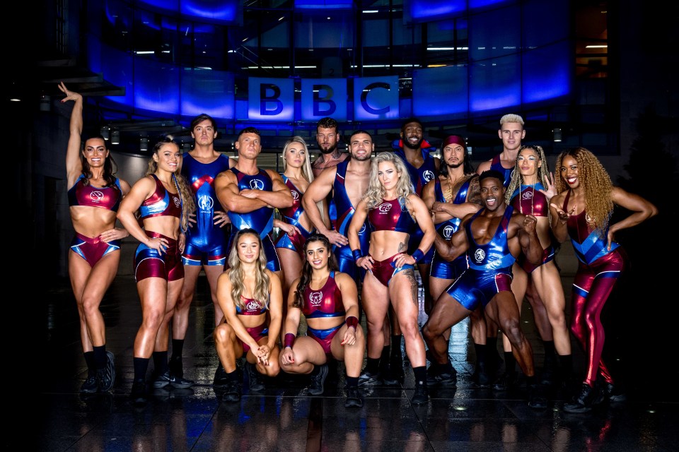 Gladiators posing for a photo outside the BBC building.