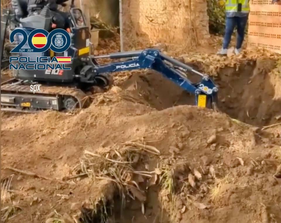 Cops use a digger to search for the missing body