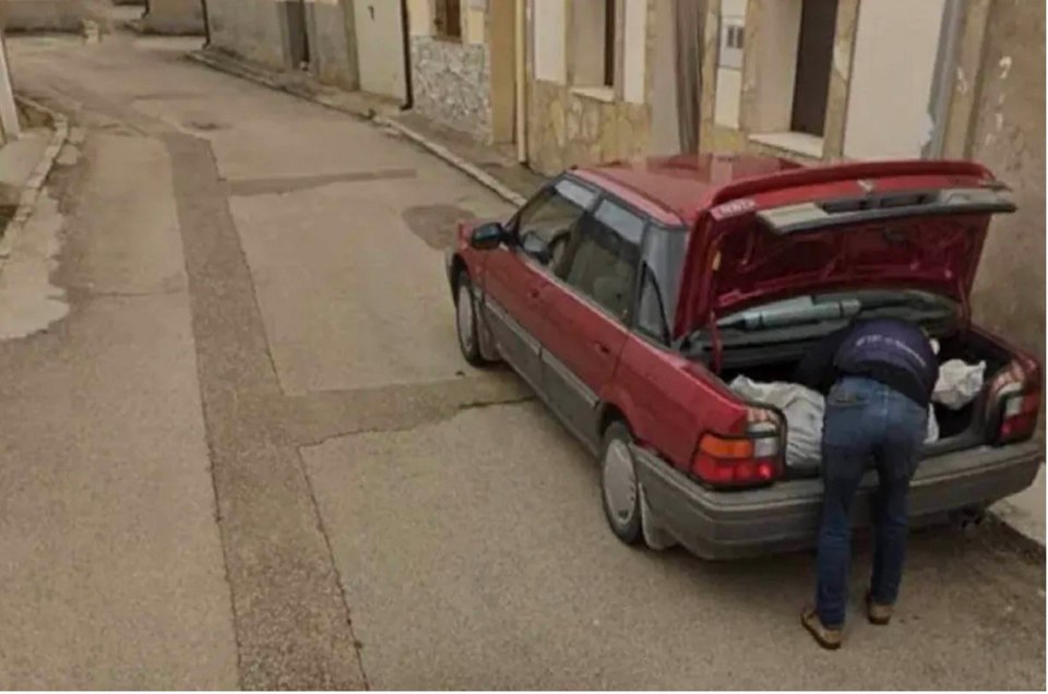 The Google Street View image appears to show a man stuffing a large plastic bag thought to contain a body