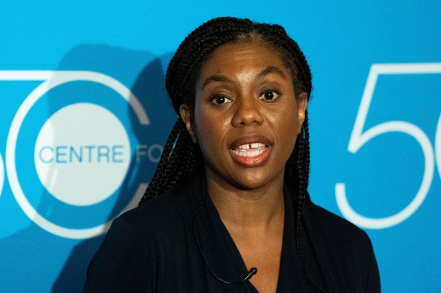 Kemi Badenoch speaking at a press conference.