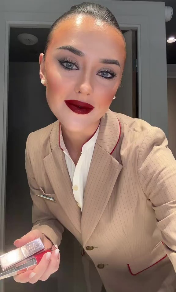 Air stewardess showing the makeup products she uses to achieve long-lasting red lips.