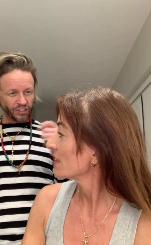 Davina McCall has revealed her scar after brain tumour surgery, as her partner Michael Douglas cut her hair