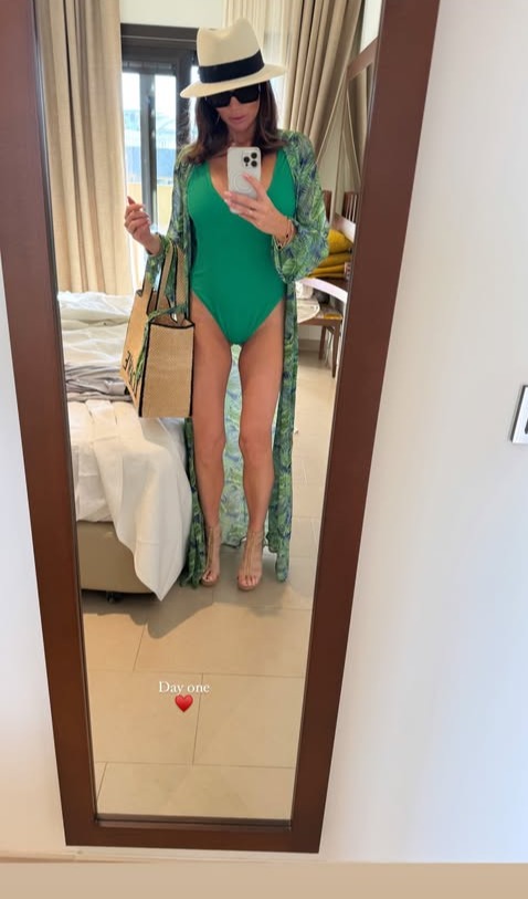 Amy Childs looked stunning as she donned a green swimsuit as she flew to Tenerife for a post-Xmas break