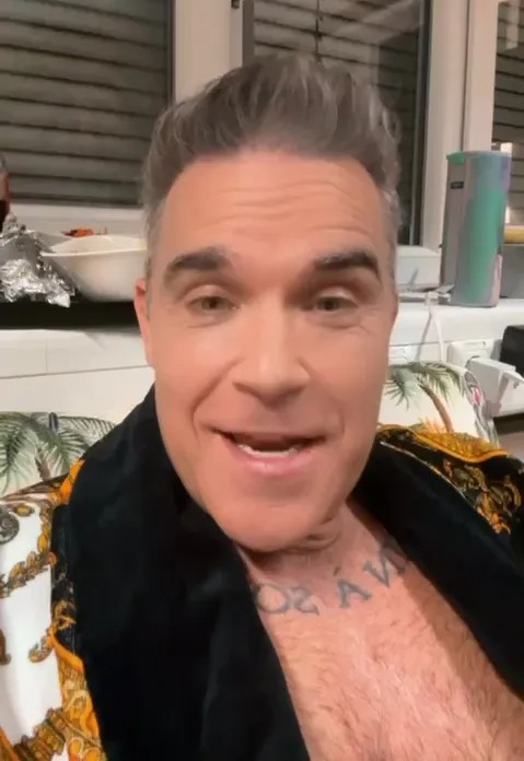 Robbie Williams has convinced a huge star to feature on Christmas Pigs