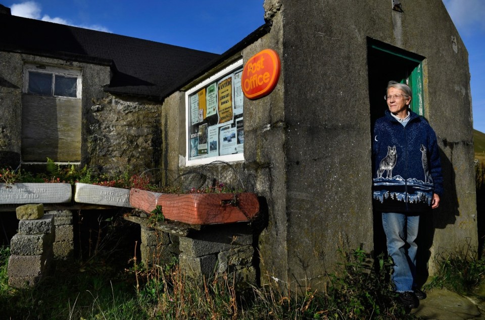 FOULA, SCOTLAND - SEPTEMBER 30: Post mistress Sheila Gear, working in the Island of Foula Post Office on September 30, 2016 in Foula, Scotland. Foula is the remotest inhabited island in Great Britain with a current population of thirty people and has been owned since the turn of the 20th century by the Holbourn family. (Photo by Jeff J Mitchell/Getty Images)