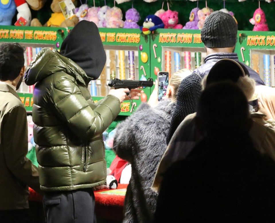 Palmer attempted to win Connie a prize at a games arcade