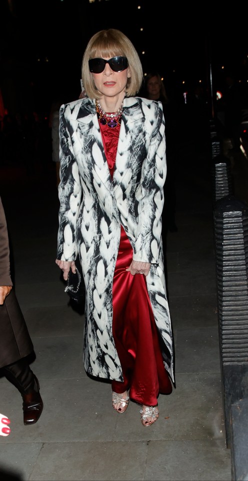 Vogue ­editor Anna Wintour appeared to channel ­Cruella de Vil in a red dress and white spotted fur jacket