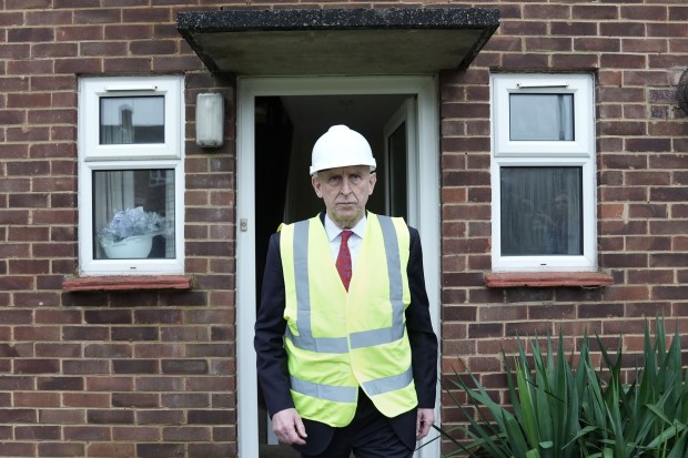 Defence Secretary John Healey at a disrepair military housing site.