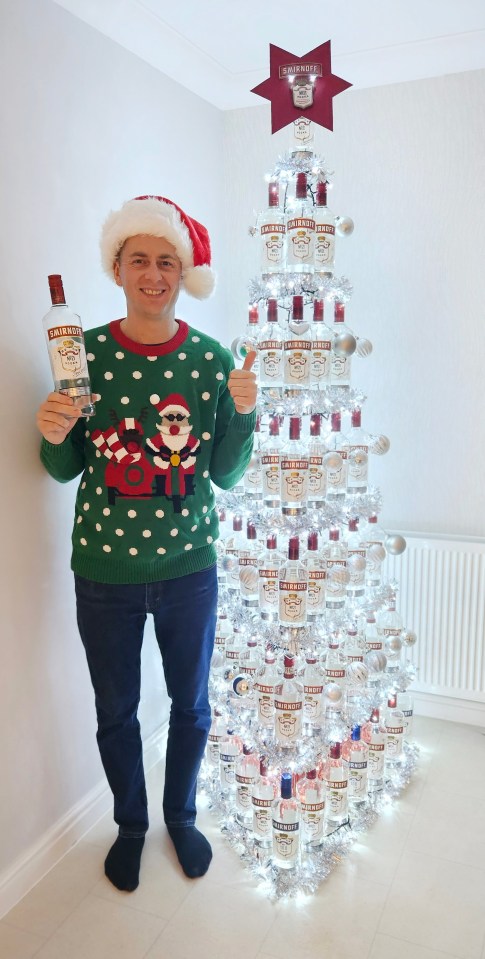 Dad Michael Shutt has got into the spirit of Christmas — by making a 7ft tree out of vodka bottles