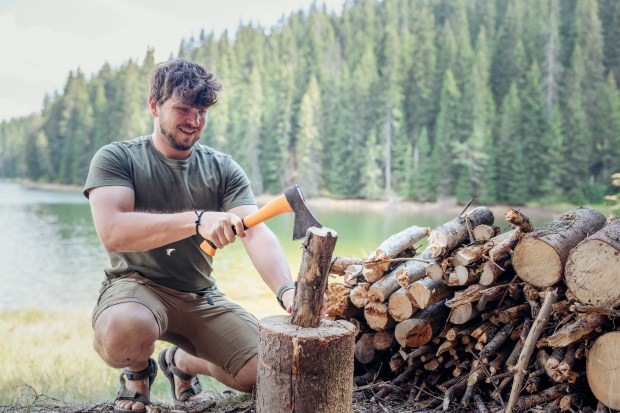 Man chopping wood for a campfire.