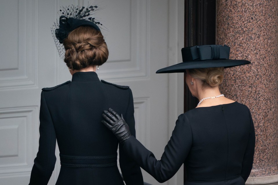 Sophie placed a supportive hand on Kate's back at the Remembrance service in November