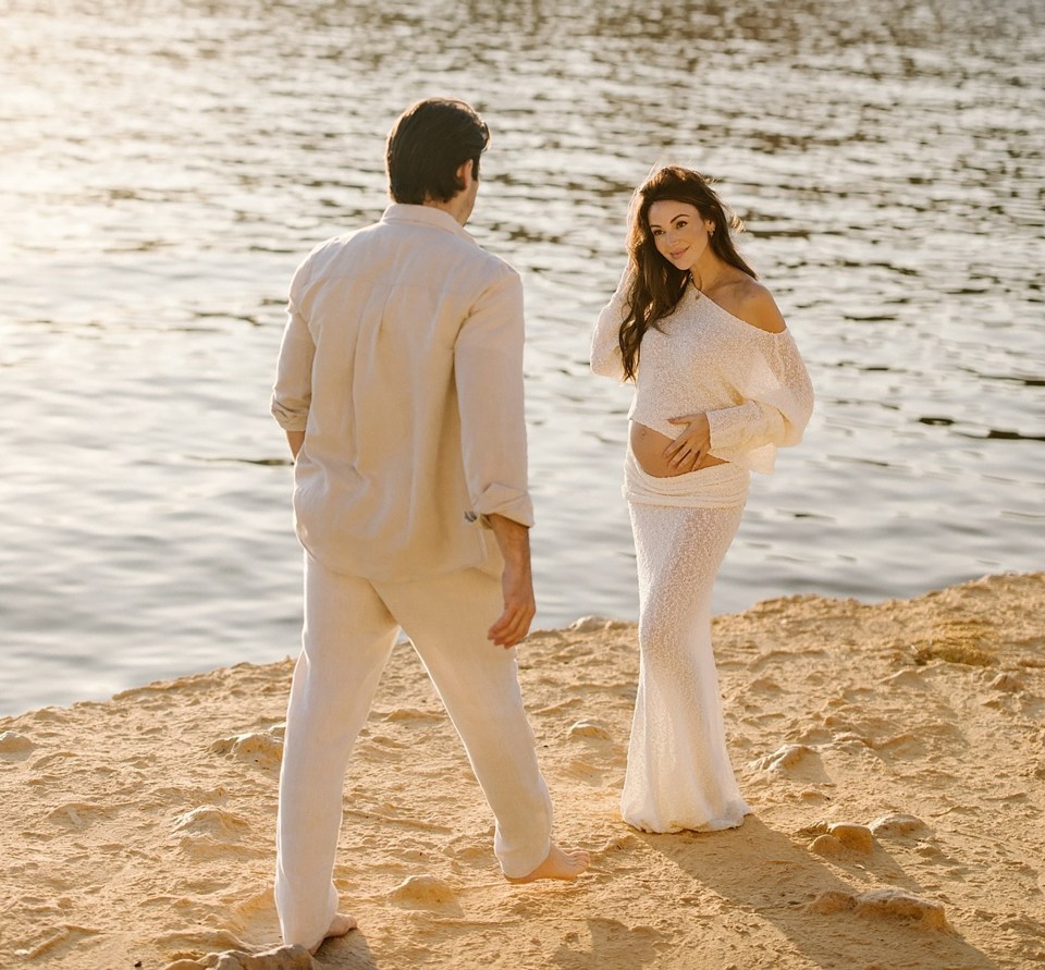 Mark and Michelle announced their pregnancy with a heartwarming Instagram post, featuring the actress cradling her baby bump on the beach