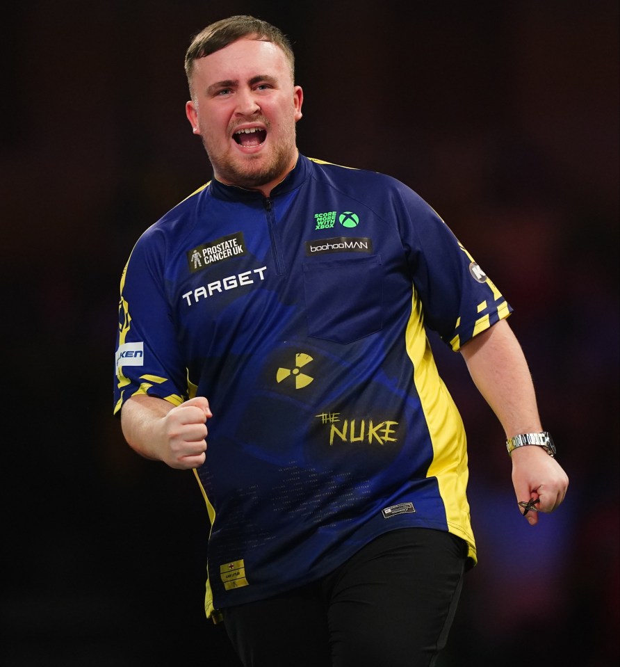 Luke Littler celebrates a darts win at the Paddy Power World Darts Championship.