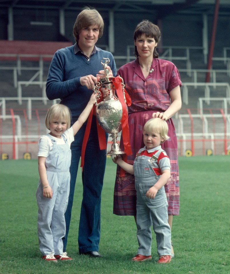 Kelly aged four at Anfield in 1980 with mum, dad, brother Paul and the League Championship trophy