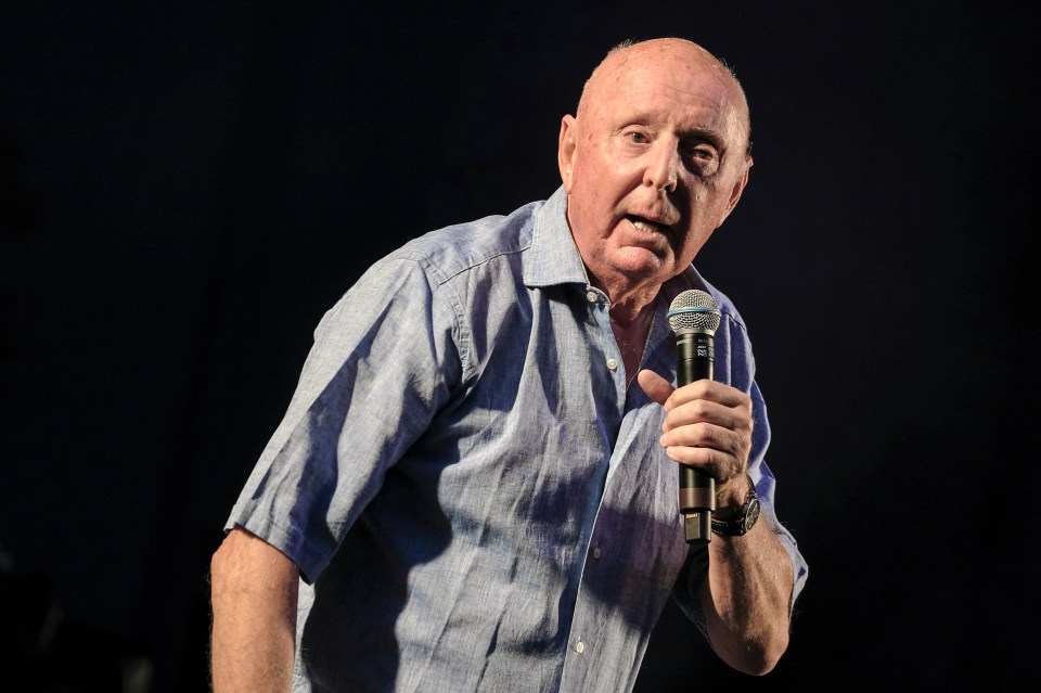 Jasper Carrott performing live on stage.